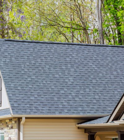 Asphalt shingles are used as roofing materials on roof of a newly constructed house